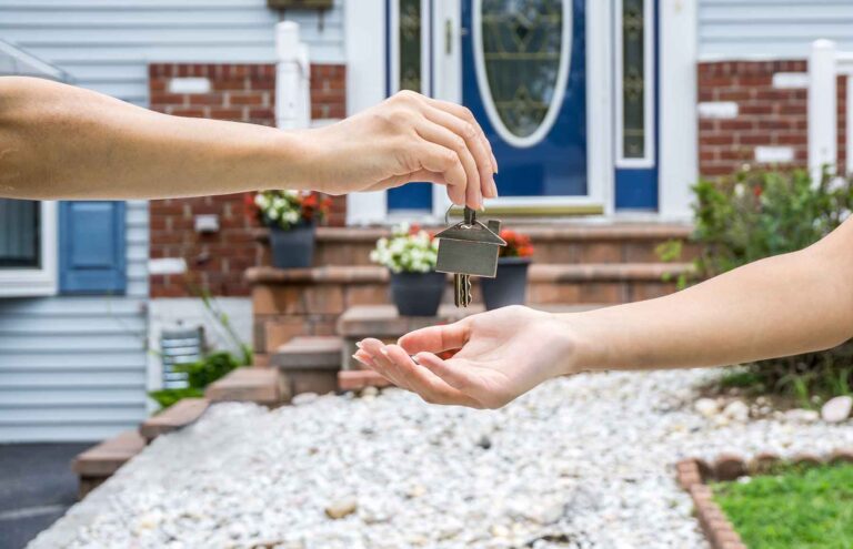 giving a key to a customer after finishing the job